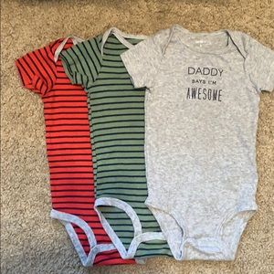 I am selling three Carter’s body suits.